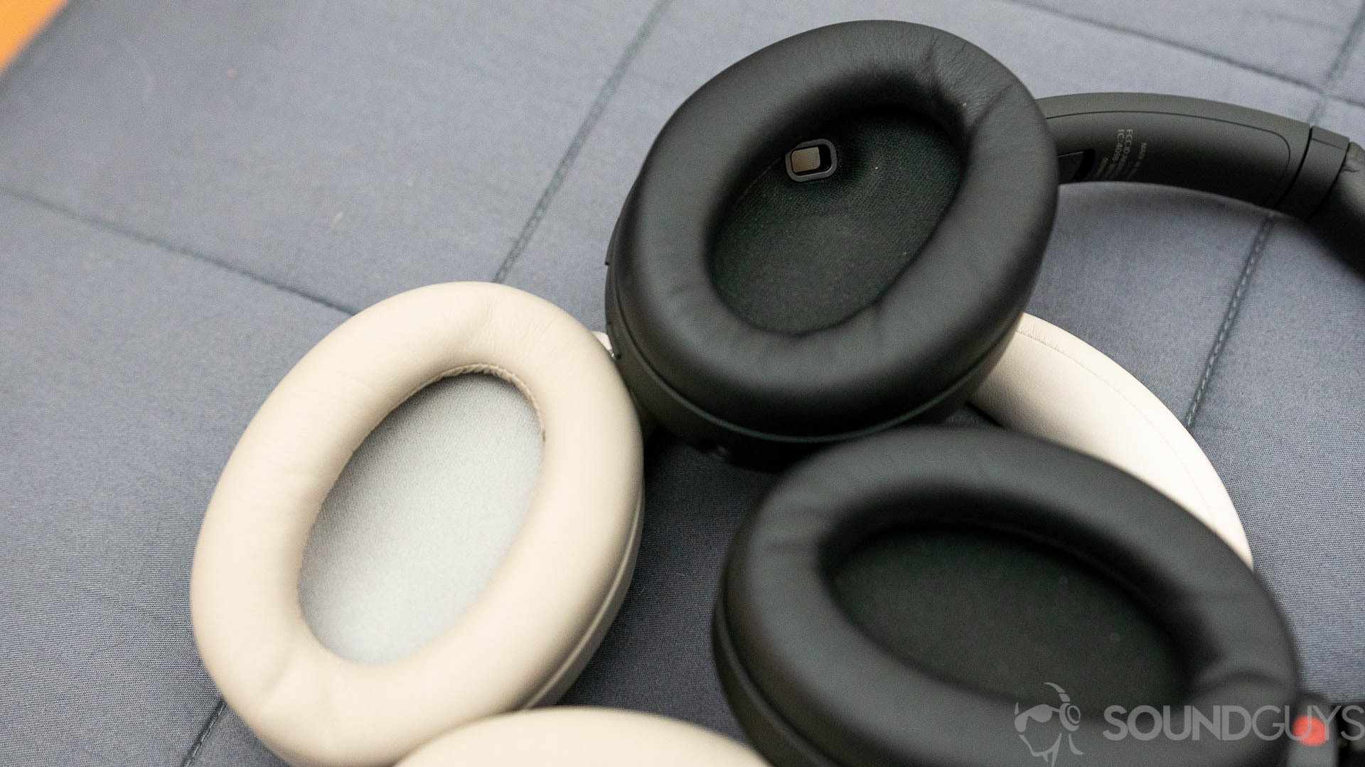 Sony WH-1000XM4 (2 of 4) A picture of the Sony WH-1000XM3 and Sony WH-1000XM4 lay on on top of the other, with their ear cups facing up, showing the interior sensor on the WH-1000XM4.