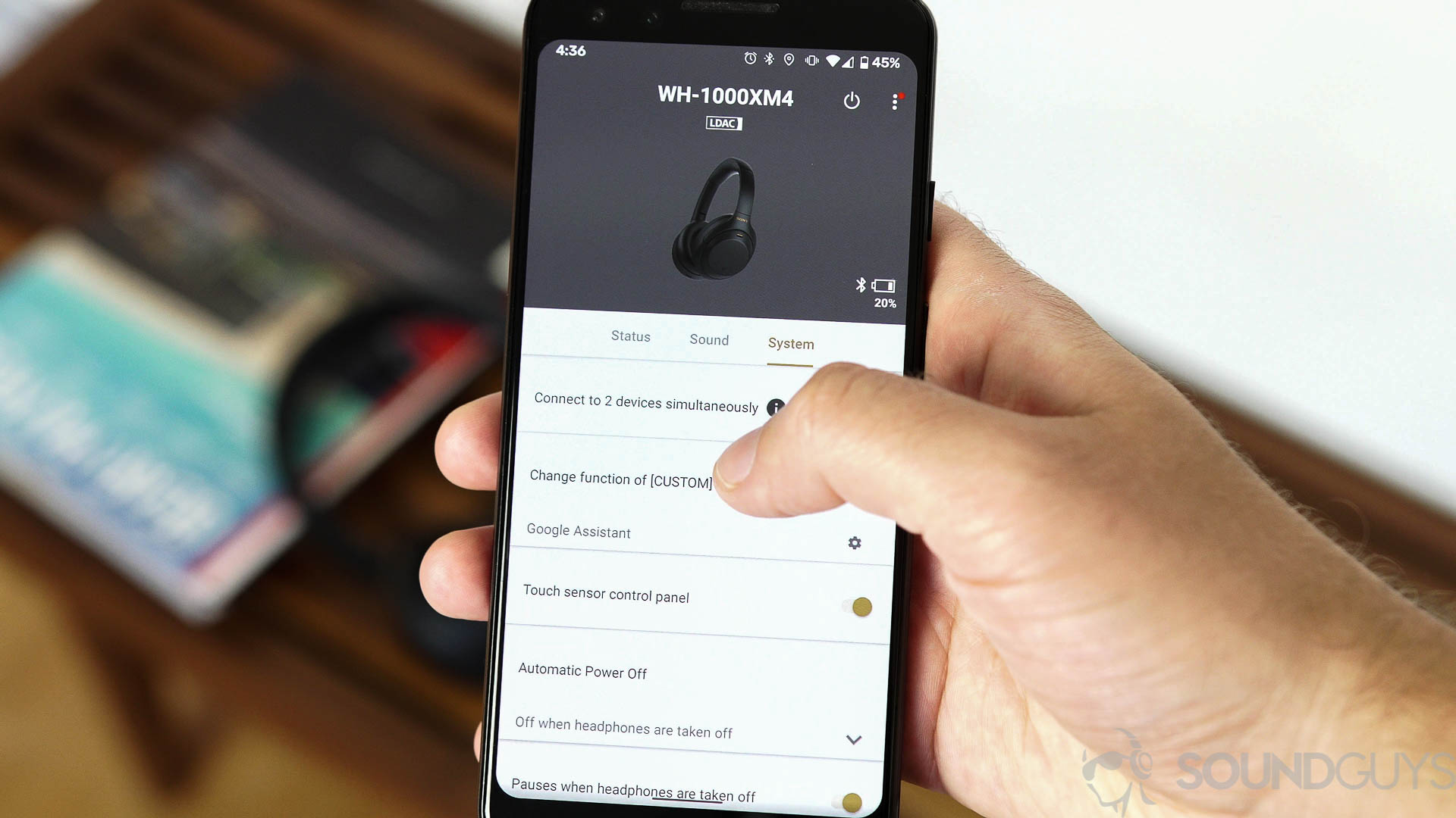 Sony headphones app for WH-1000XM4 Pictured is a man using a Pixel 3 with the Sony Headphones app open