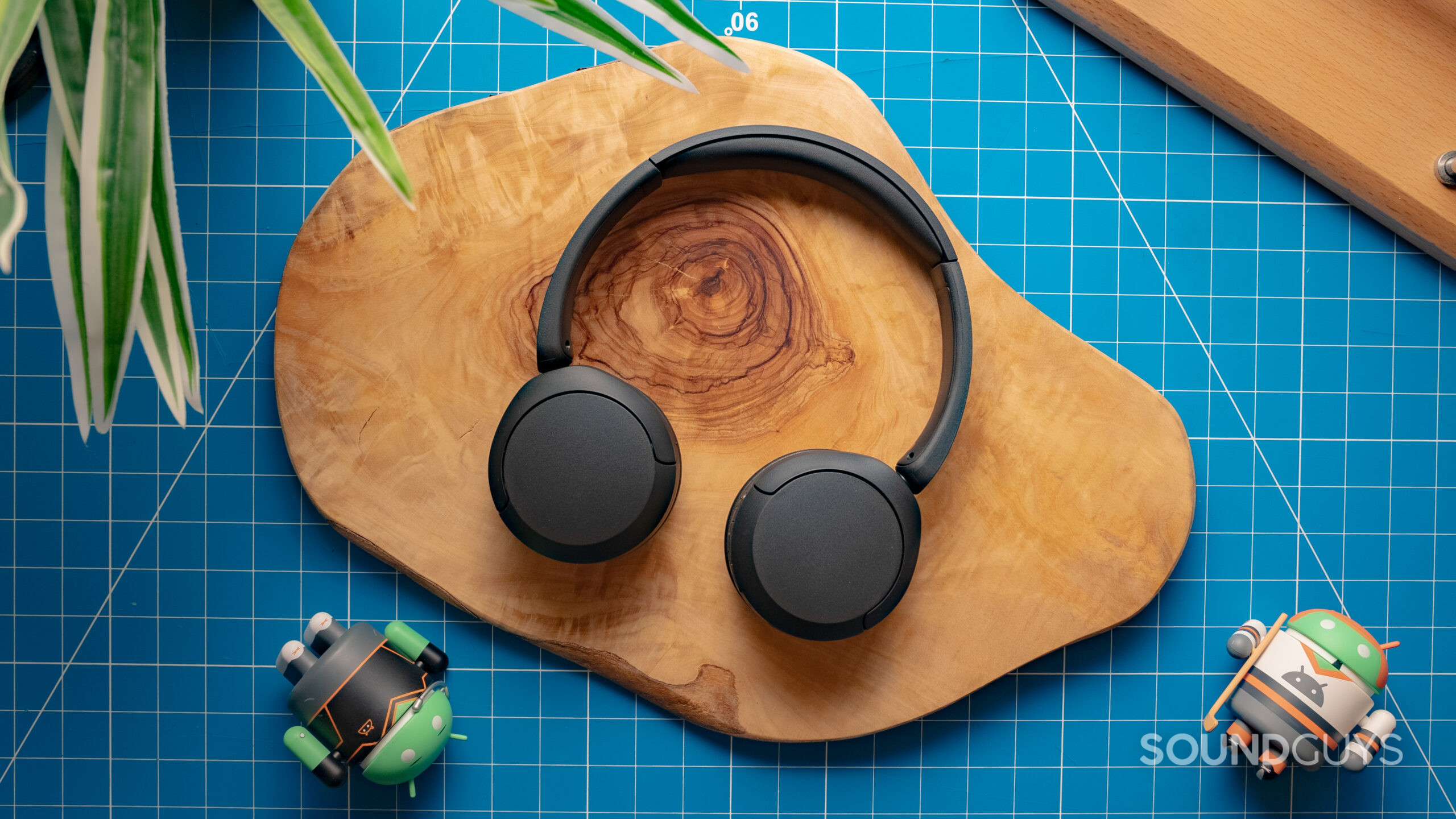 Sony WH-CH520 Featured Image #1 The Sony WH-CH520 sits atop a wood slab.