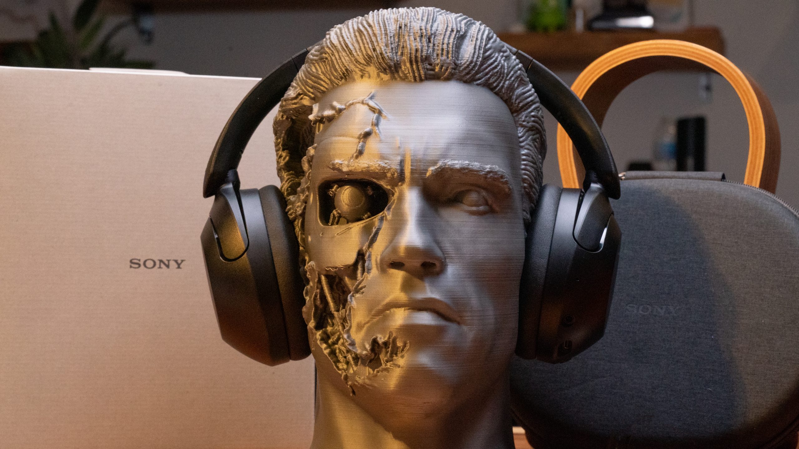 sony-wh-xb910n-arnie A bust of The Terminator faces the camera head on wearing the Sony WH-XB910N.