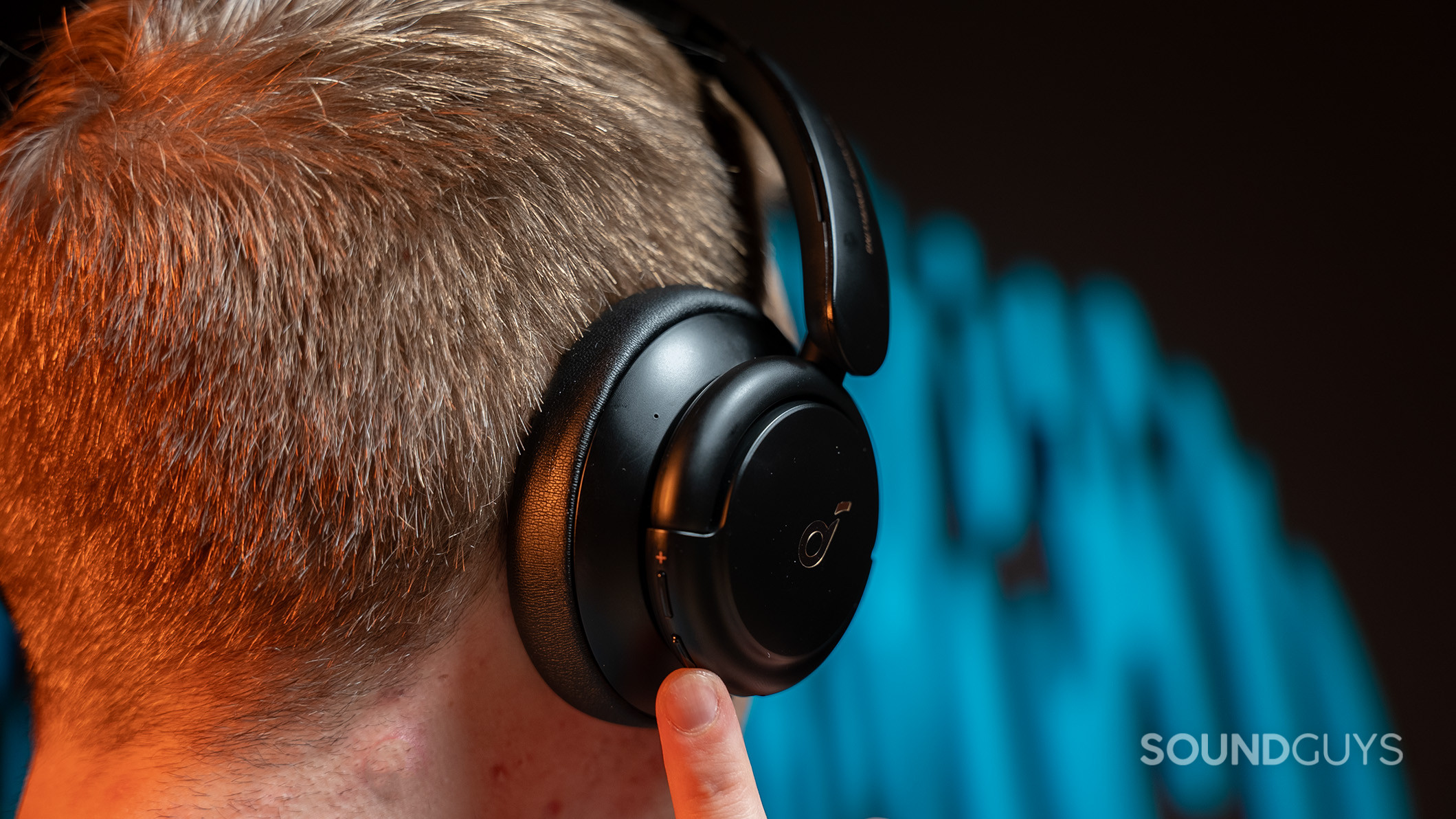 Soundcore Life Q30 volume buttons A man presses a button on the Anker Soundcore Life Q30.