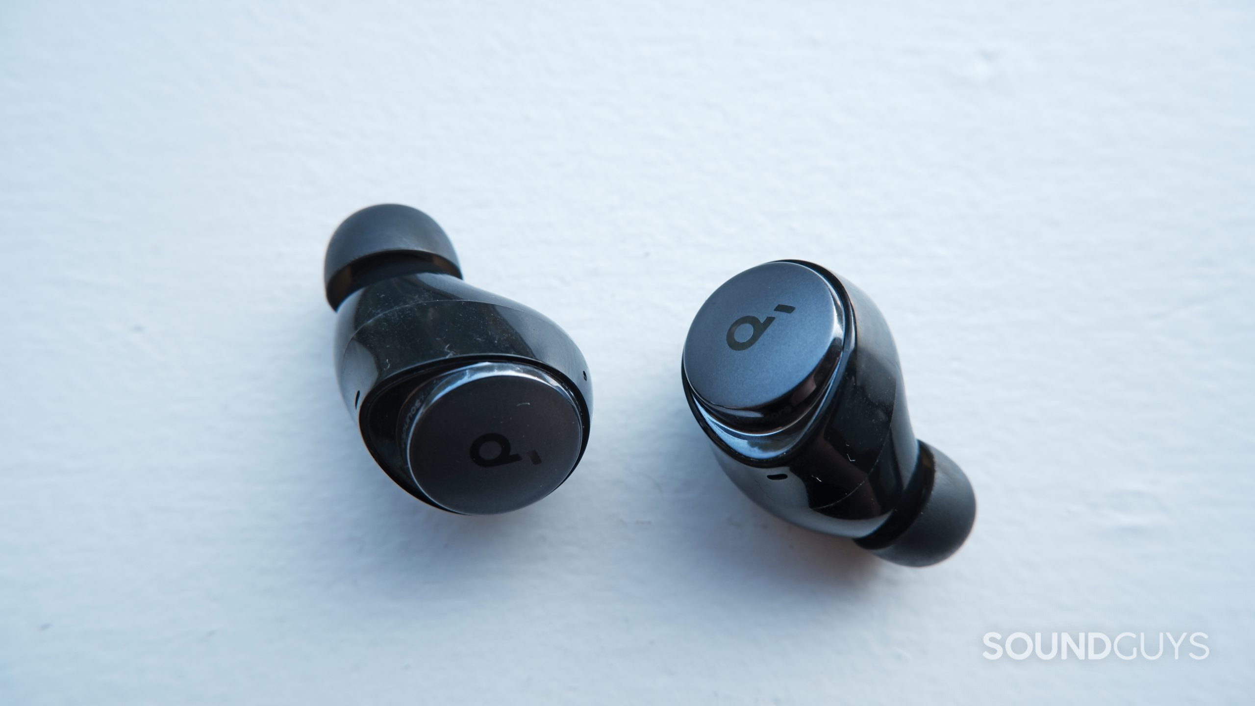 space-a40-buds-up-close The Anker Soundcore Space A40 earbuds up close on a white surface.