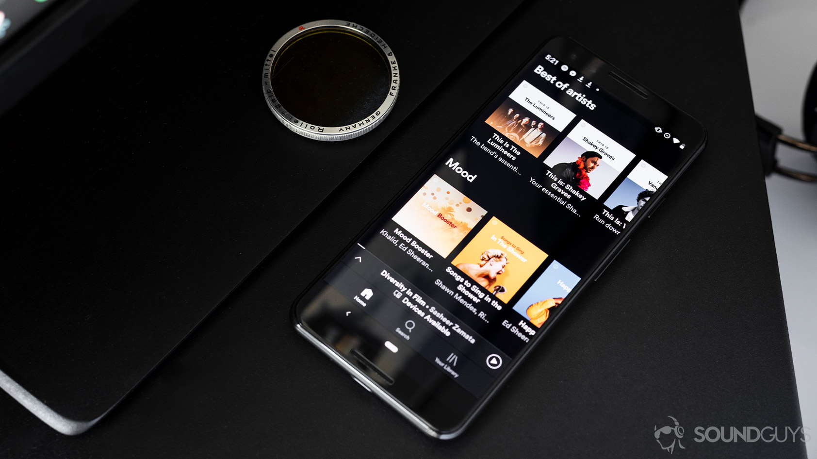 Spotify-5_app home Google Pixel 3 desk Spotify app open on a Google Pixel 3.