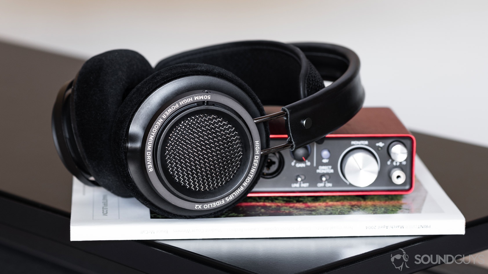 Tidal-4_Philips Fidelio open back headphones Scarlett 2i2 Focusrite The Philips Fidelio open-back headphones on a Focusrite Scarlett 2i2 desktop interface.
