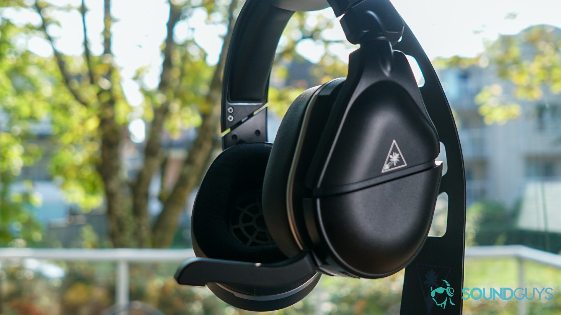 Turtle Beach Stealth 700 Gen 2 window shot The Turtle Beach Stealth 700 Gen 2 headset against a backyard setting.