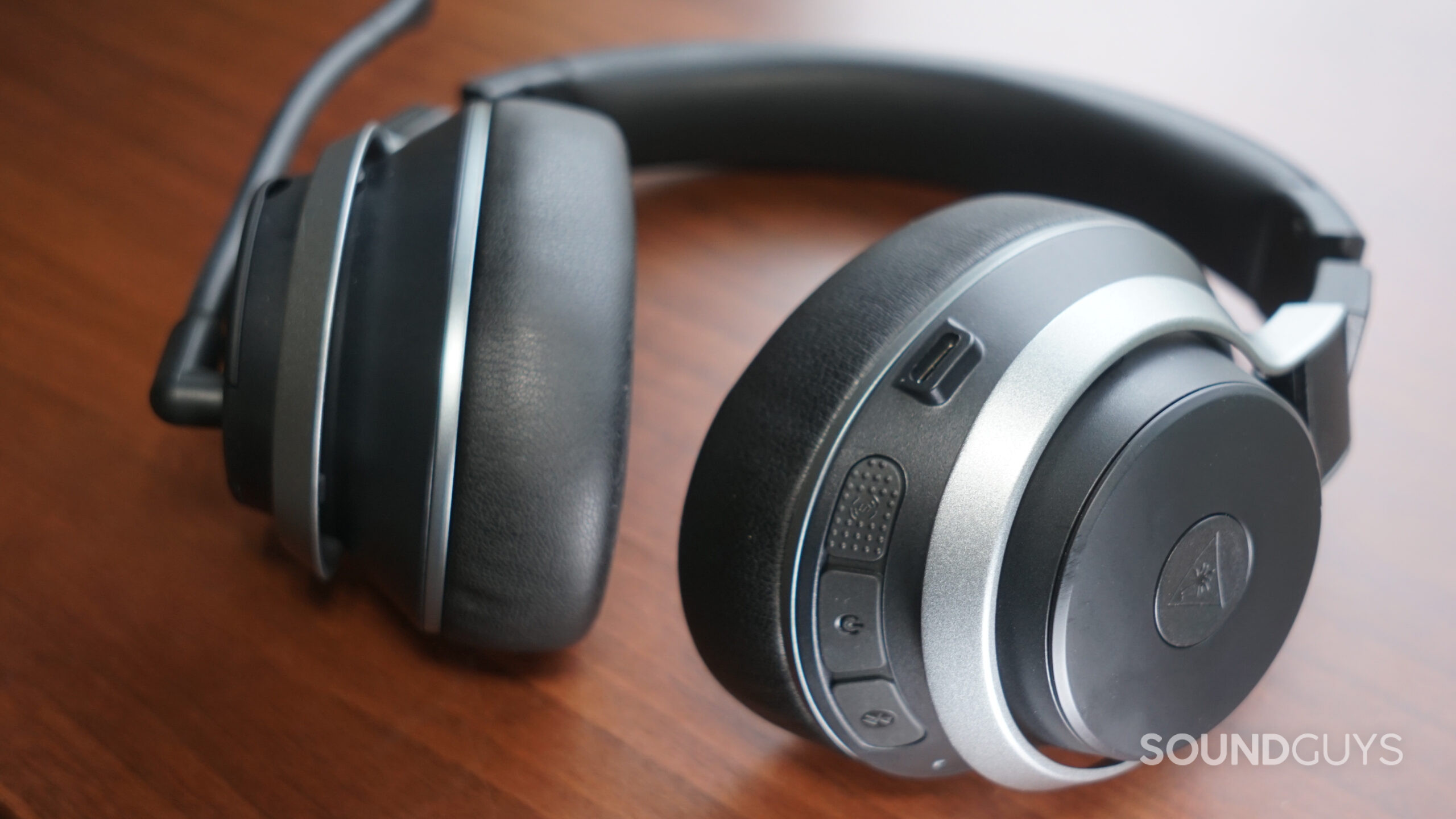Turtle-Beach-Stealth-Pro-controls The Turtle Beach Stealth Pro gaming headset lays on a wooden surface with its on-ear controls in view