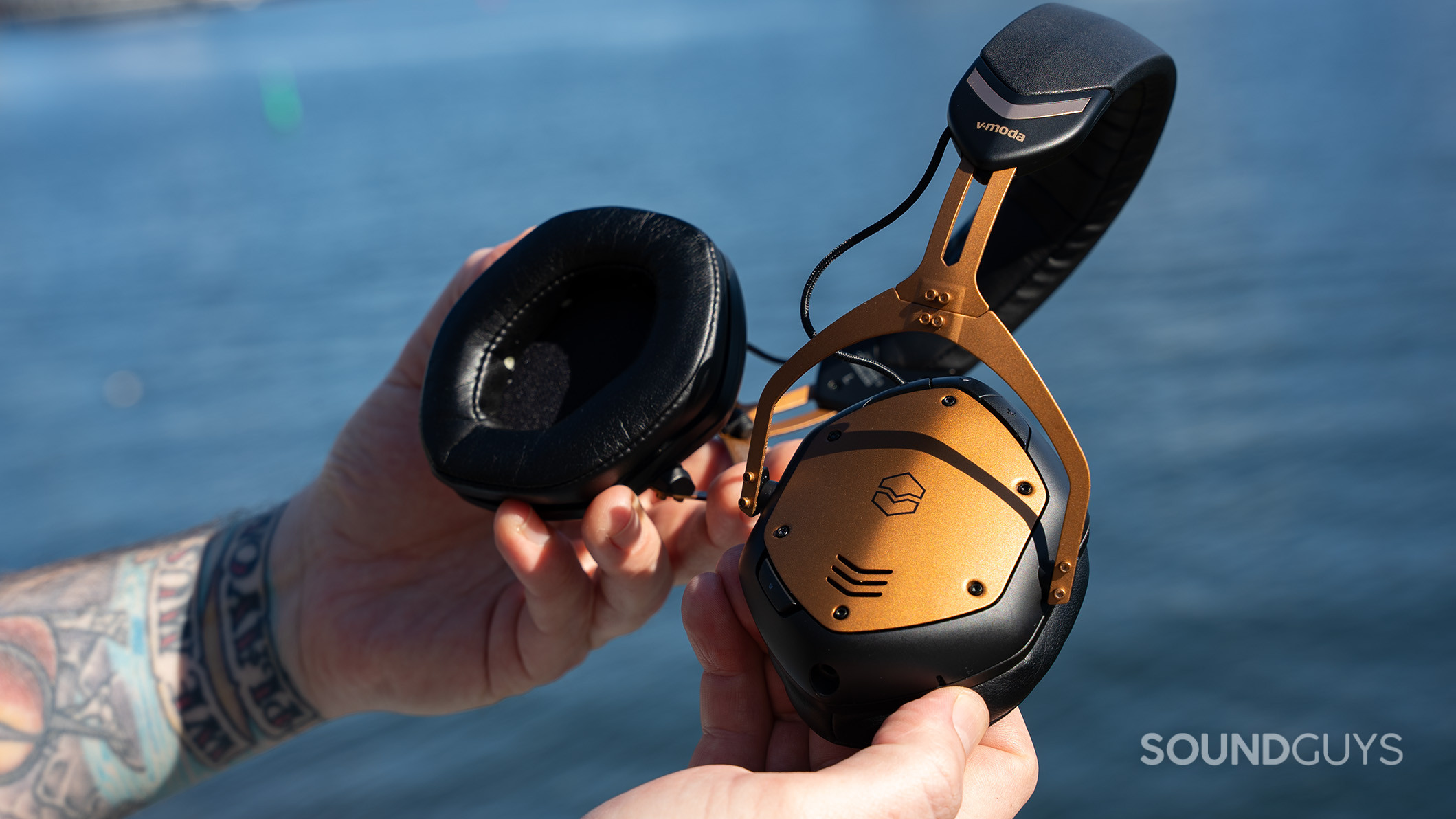 V-moda Crossfade 3 Wireless bend 2 The V-MODA Crossfade 3 Wireless headphones are bent over a body of water.