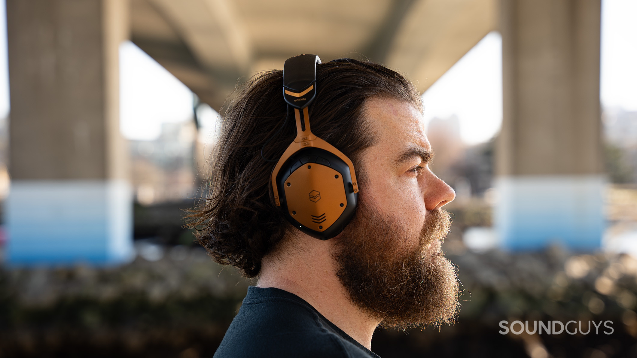 V-moda Crossfade 3 Wireless on man under bridge 2 A man wears the V-MODA Crossfade 3 Wireless headphones.