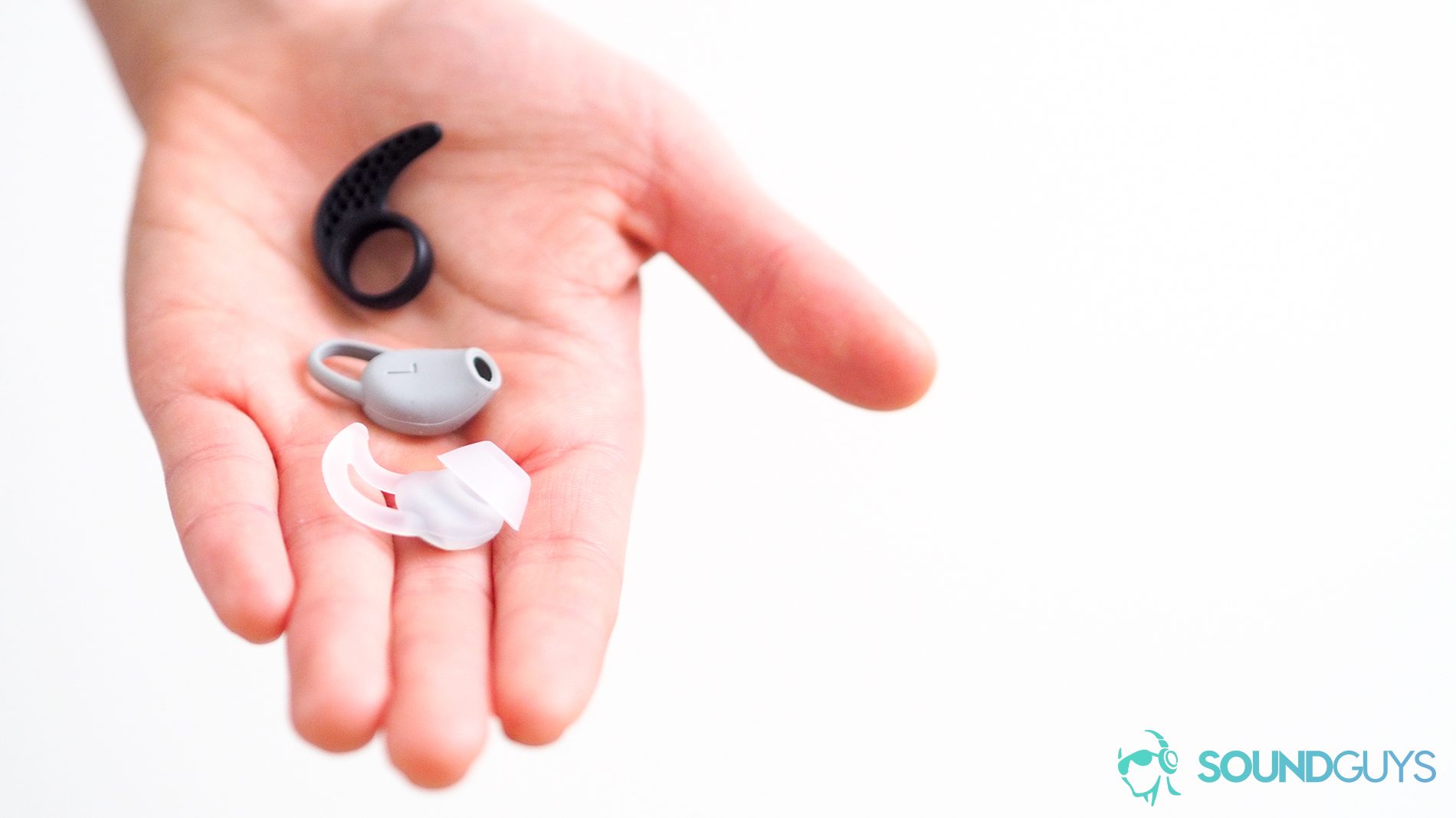 Wingtips_Jaybird Plantronics Bose_LK_SG best workout earbuds - ear tips in the palm of a woman's hand.